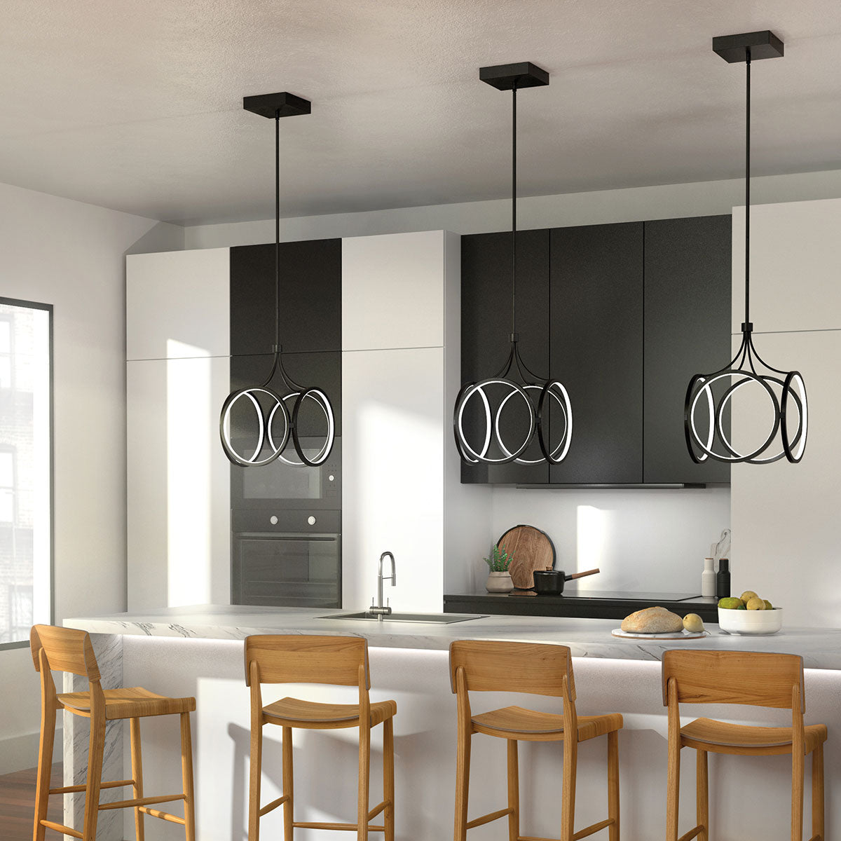 Kitchen with black pendant lights and oak bar stools