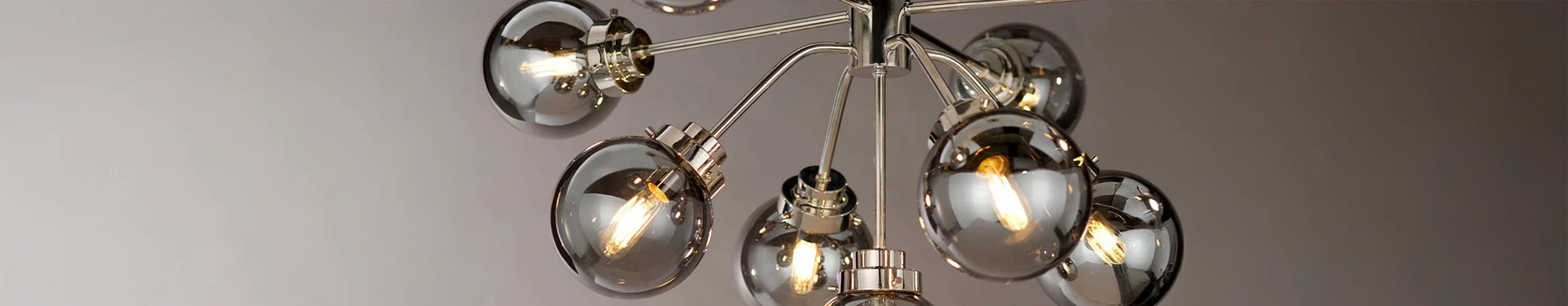 Smoked Grey Glass Pendant Light on Plain Grey Wall