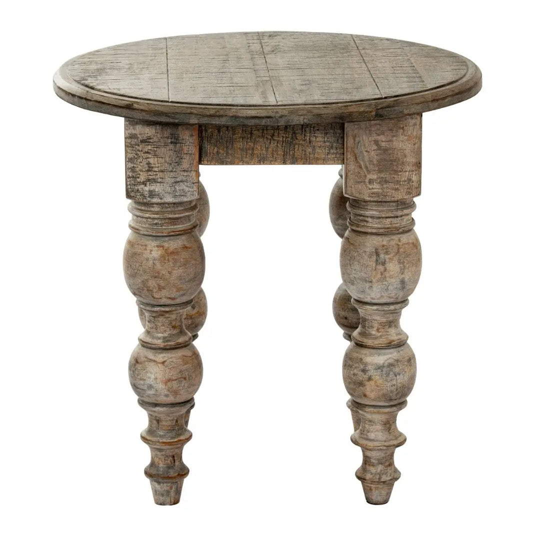 Round wooden table with turned legs on a white background