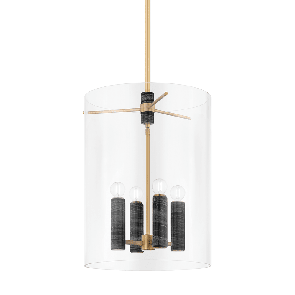 The Adonis Lantern Light - Brass features a modern lantern silhouette with a clear cylindrical glass shade, vintage brass and gold metal rod, and four black cylindrical bulb holders with exposed bulbs, blending gold, black, and transparent elements.