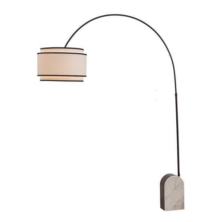 Curved floor lamp with marble base and white shade with black contrast piping on a white background