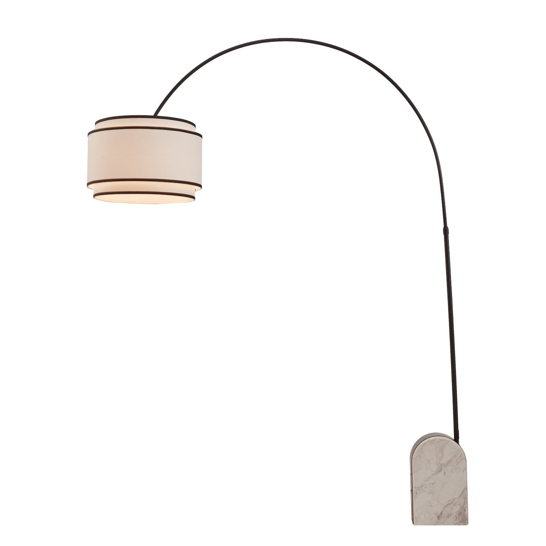 Curved floor lamp with marble base and white shade with black contrast piping on a white background
