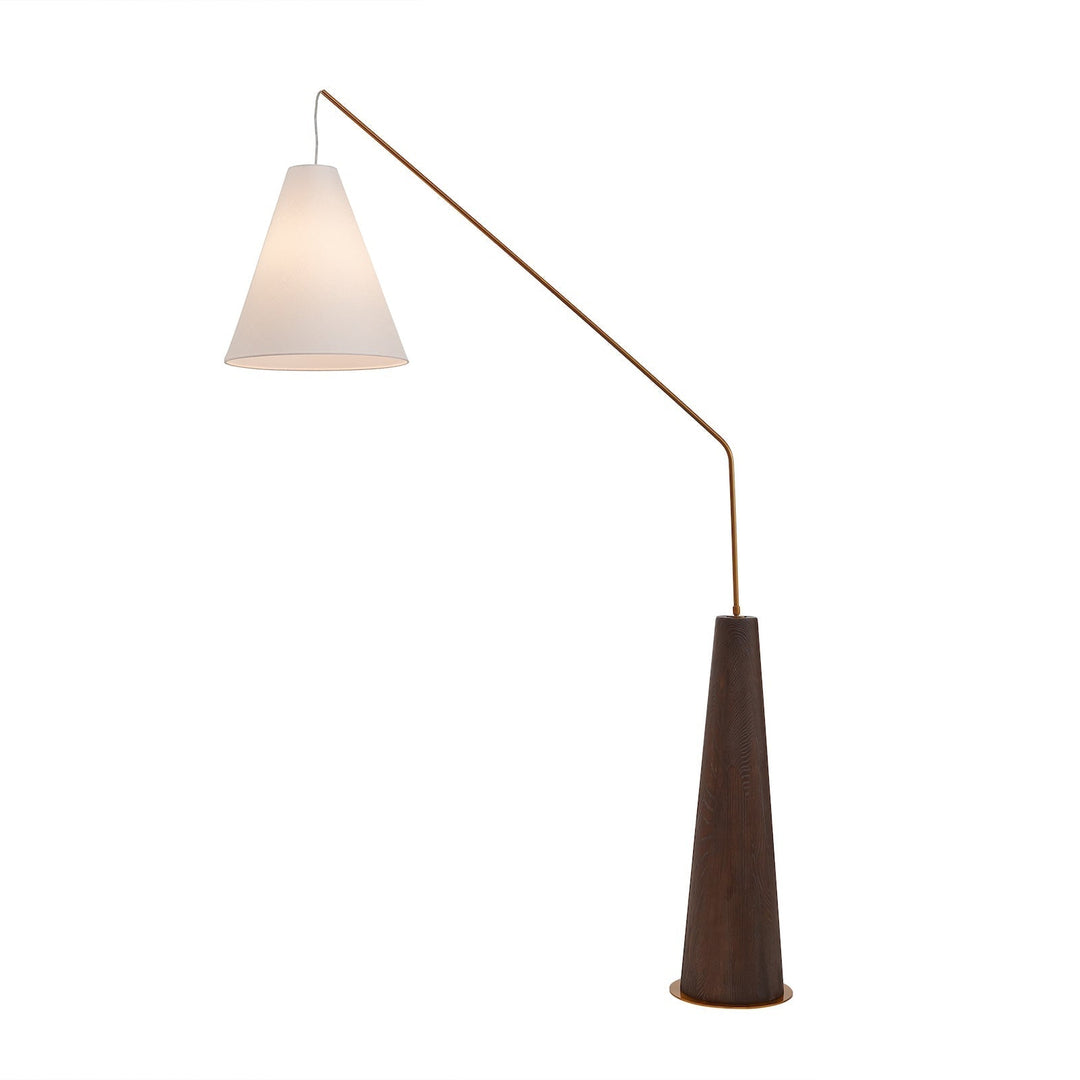 Wooden base angular lamp turned on on plain white background