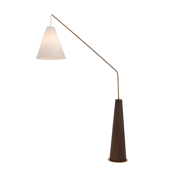 Wooden base angular lamp turned on on plain white background