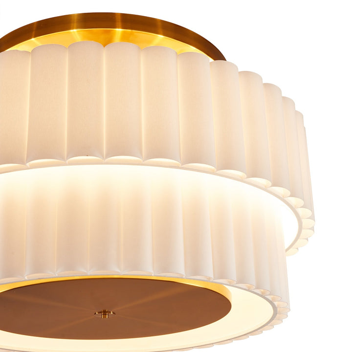 Close up of white ceiling lamp with bronze accent fixing on a white background