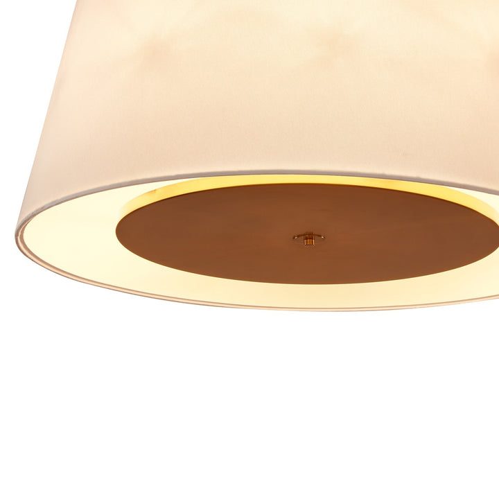 Close up of white ceiling lamp with bronze accent fixing on a white background