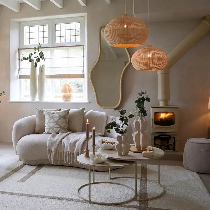 Cozy living room with a fireplace, sofa, and decorative items.