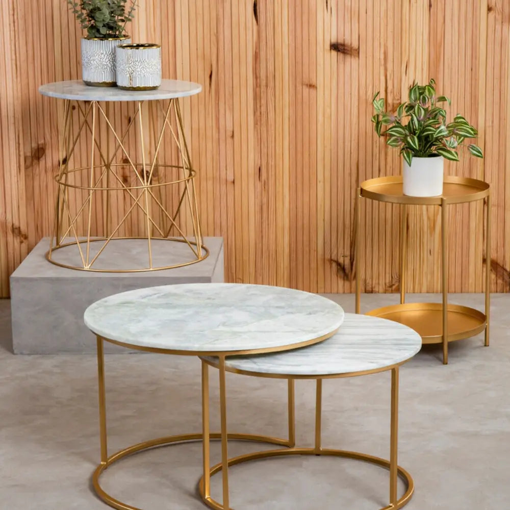 Selection of coffee tables and side tables in marble and gold