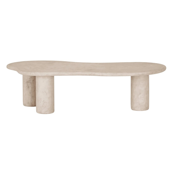Beige stone coffee table with cylindrical legs on a white background