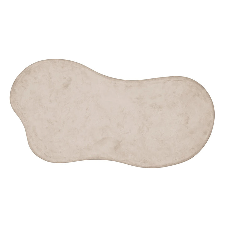 Beige stone with a wavy surface on a white background