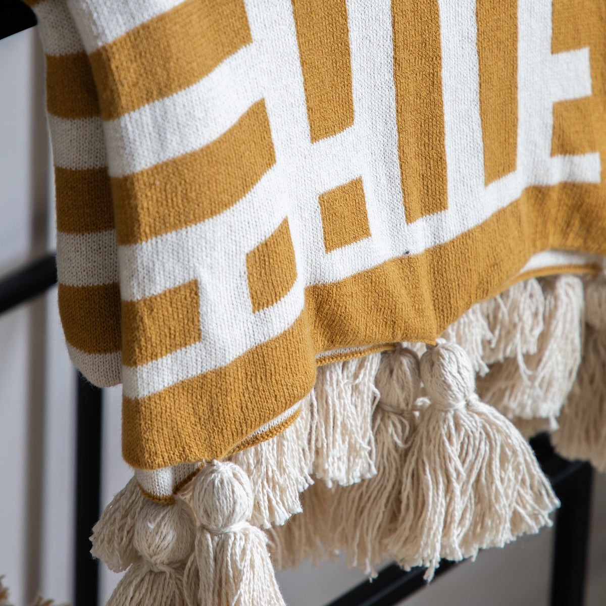 Gallery Interiors Merton Knitted Tassel Throw Ochre