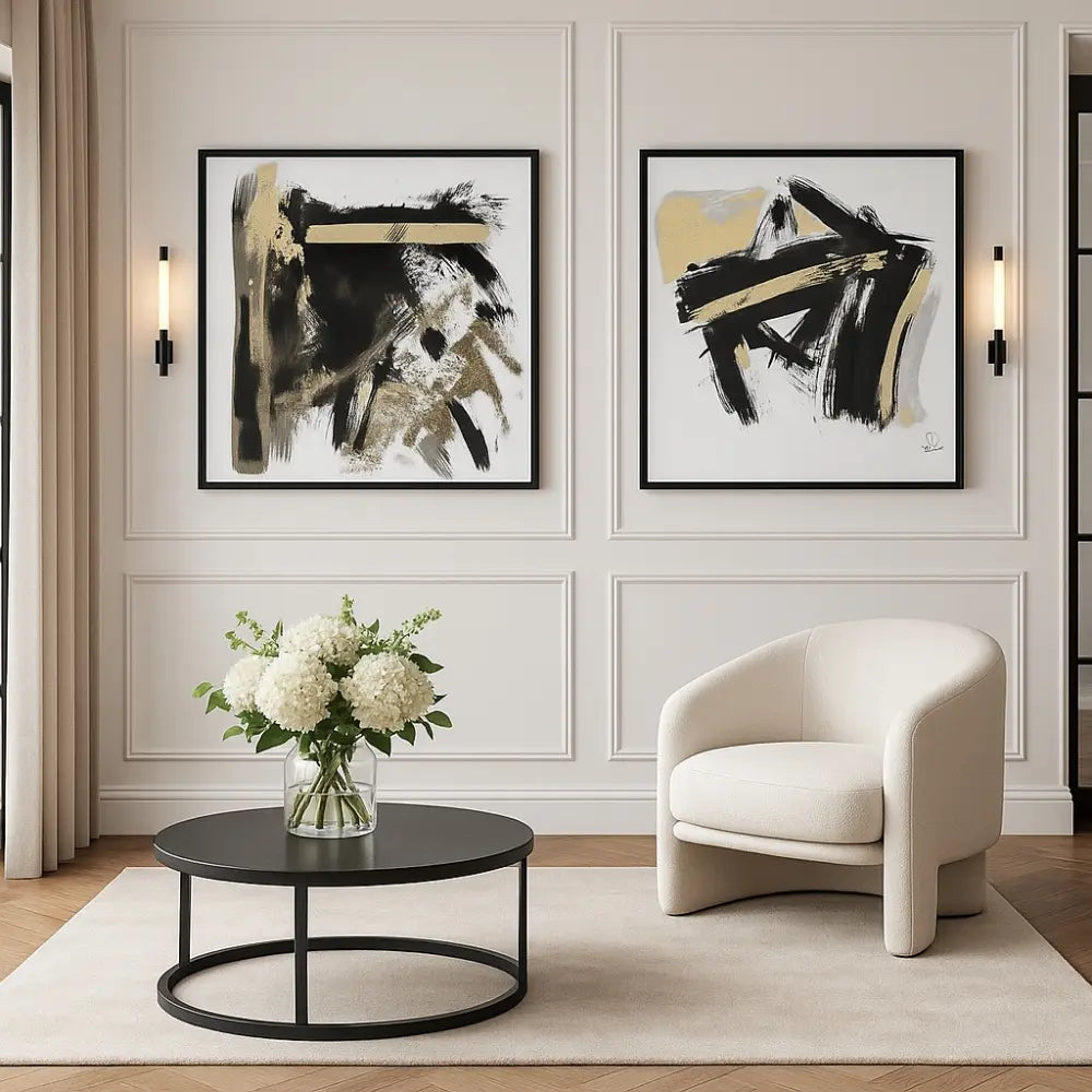 Modern living room with abstract art, a white armchair, and a round coffee table.