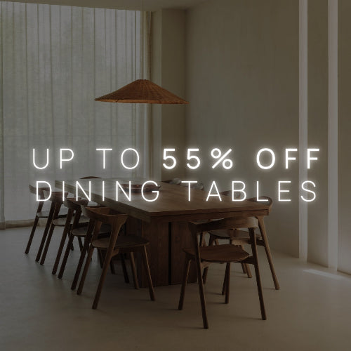 Wooden dining table with chairs in a room with a large window, promotional text overlay.