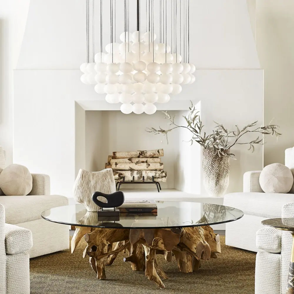 Light airy living room decor with globe chandelier