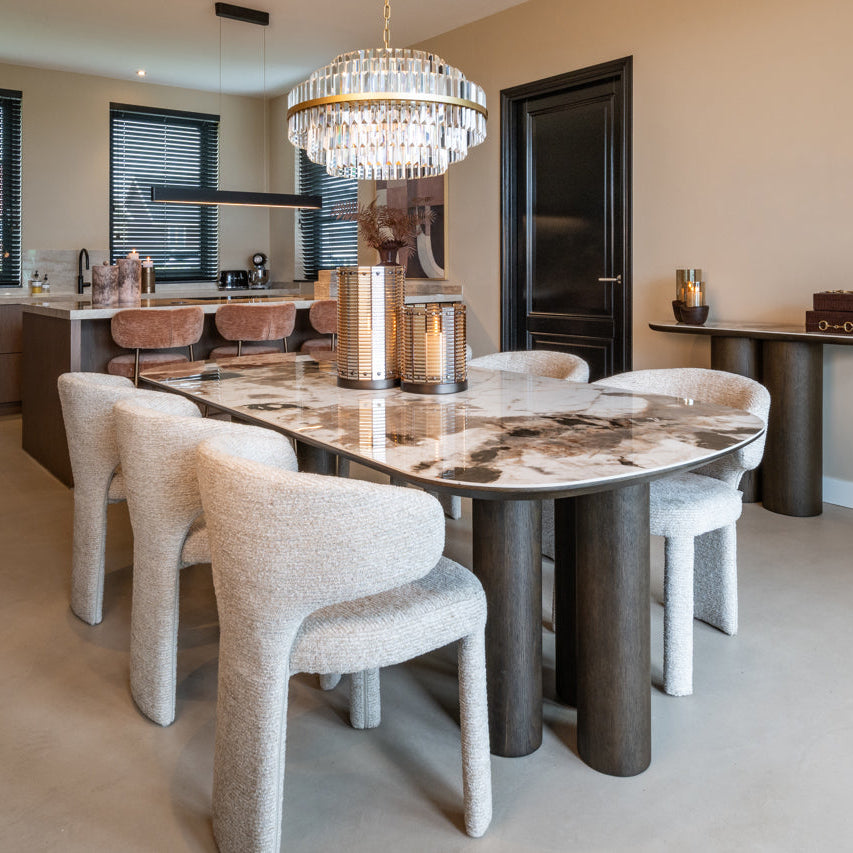 Modern kitchen with marble island and chairs in a stylish home setting