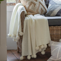 Gallery Interiors Moss Stitched Pom Pom Throw Cream