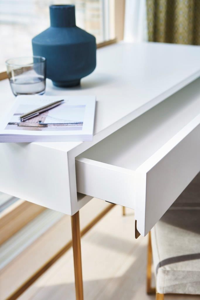 White desk with 2024 brass legs