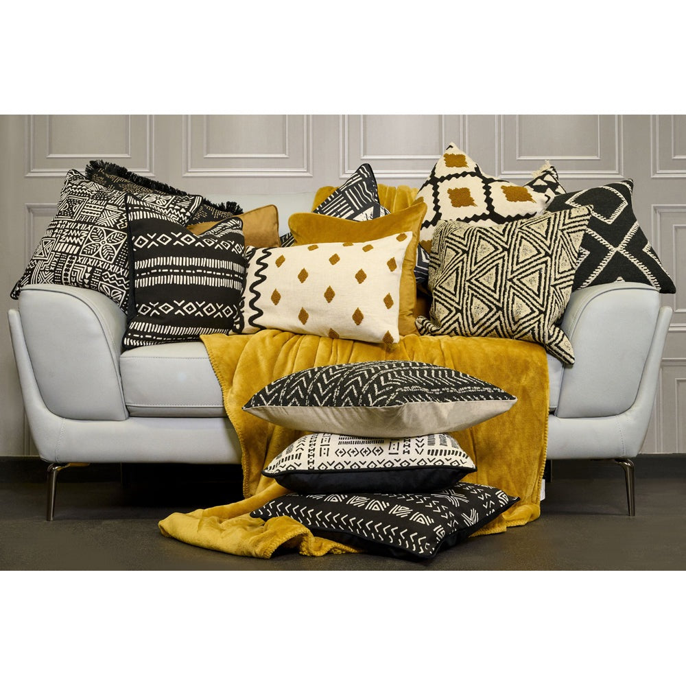 Mustard and shop black cushions